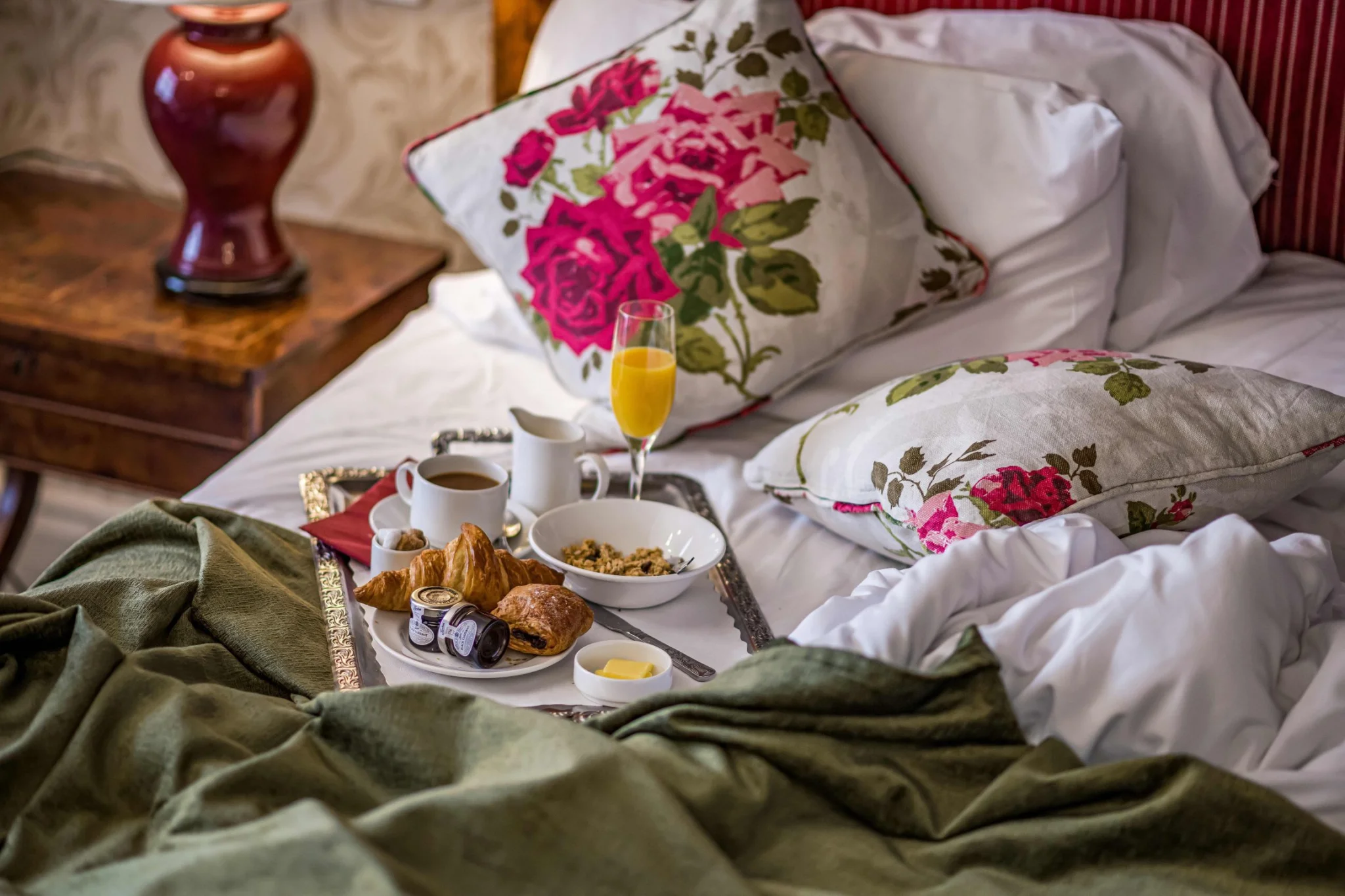 Messy bed with breakfast at the speech house